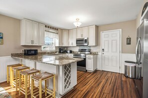 Dishwasher, coffee/tea maker, highchair, cookware/dishes/utensils