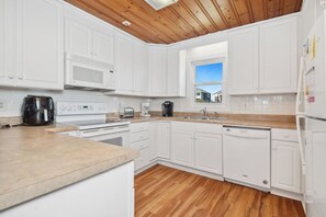 Dishwasher, coffee/tea maker, highchair, cookware/dishes/utensils