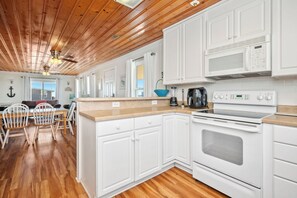 Dishwasher, coffee/tea maker, highchair, cookware/dishes/utensils