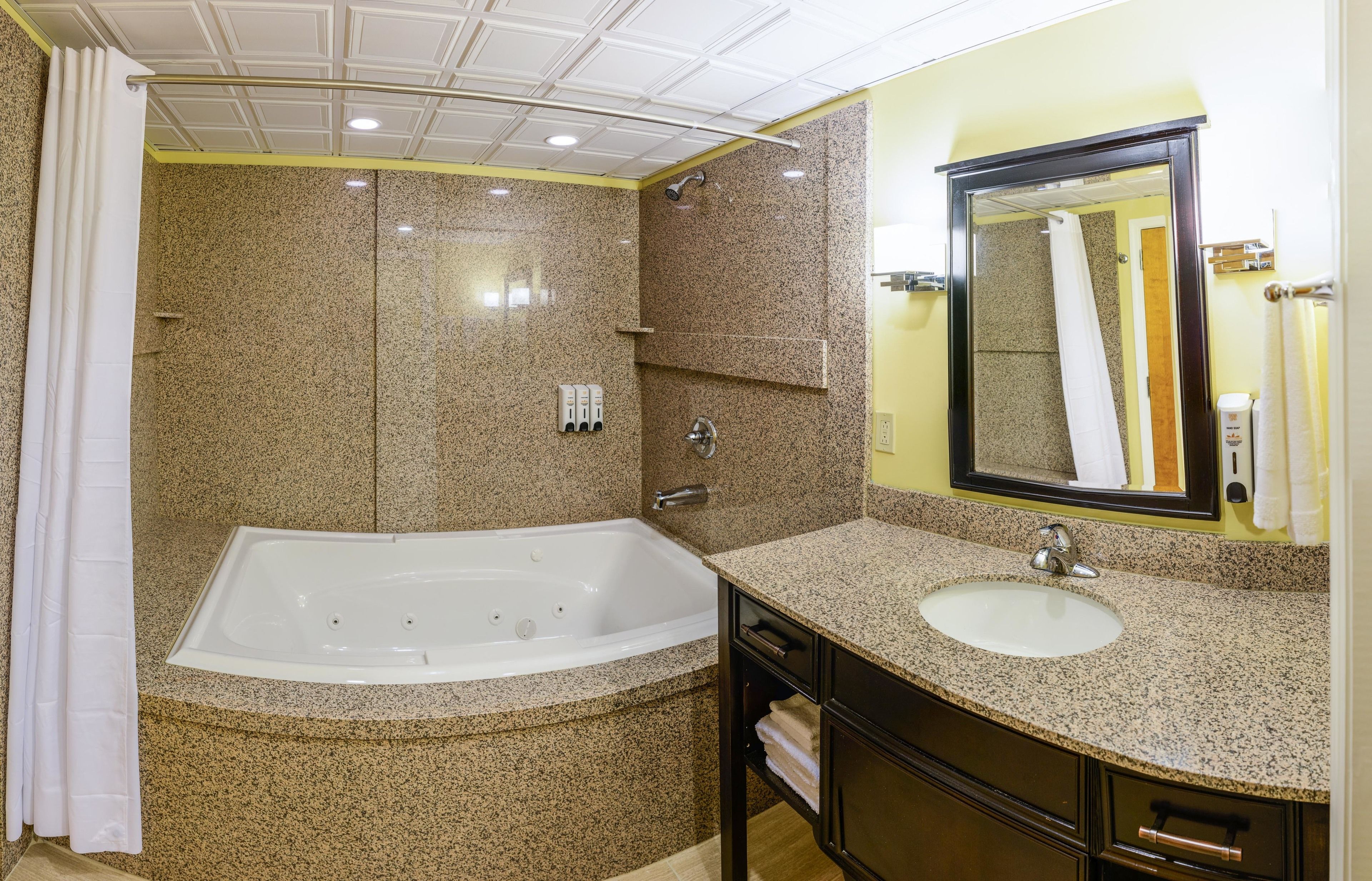 honeymoon suite, 1 king bed, non smoking | bathroom | eco-friendly toiletries, hair dryer, towels