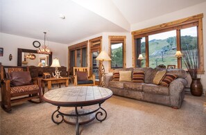 Standard Condo, 4 Bedrooms | Living area | 27-inch flat-screen TV with cable channels, TV, fireplace - Antlers at Christie Base by Resort Lodging Company (Steamboat Springs)