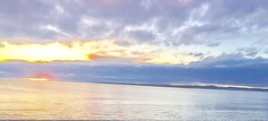 A body of water reflecting the sky during sunset. - Tigh Na Mara (Fortrose)