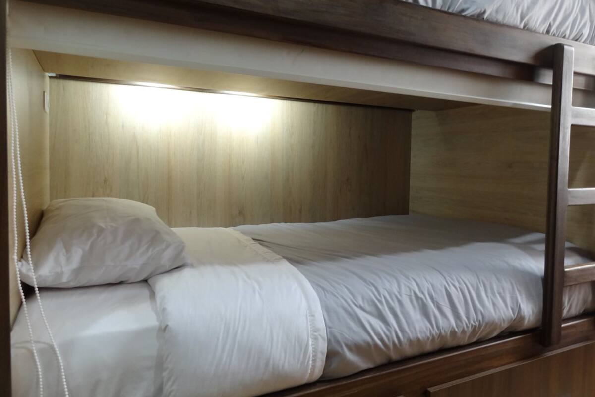 Premium bedding, down duvets, blackout curtains, free WiFi