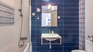 Bathtub, hair dryer, towels