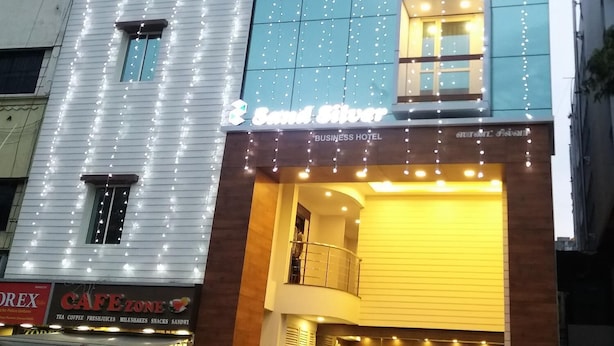 A building with a sign for 'Band Silver' and 'Business Hotel' on the ground floor. - Sand Silver Business Hotel (Chennai)