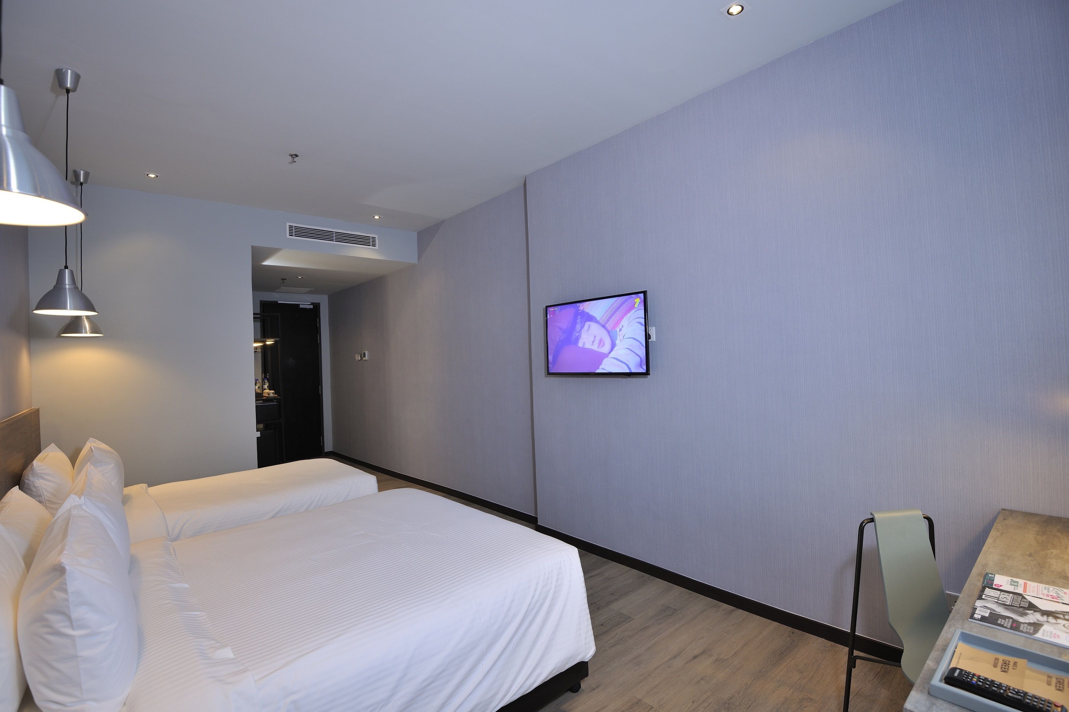 deluxe triple room | in-room safe, desk, iron/ironing board, free wifi