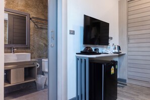 A compact bathroom with a sink, toilet, and a mirror. - Coco Retreat Phuket Resort and Spa Sha+ (Chalong)