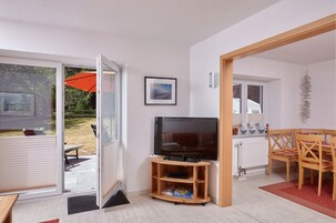 House (A) | Living area | 42-inch flat-screen TV with satellite channels, TV, DVD player