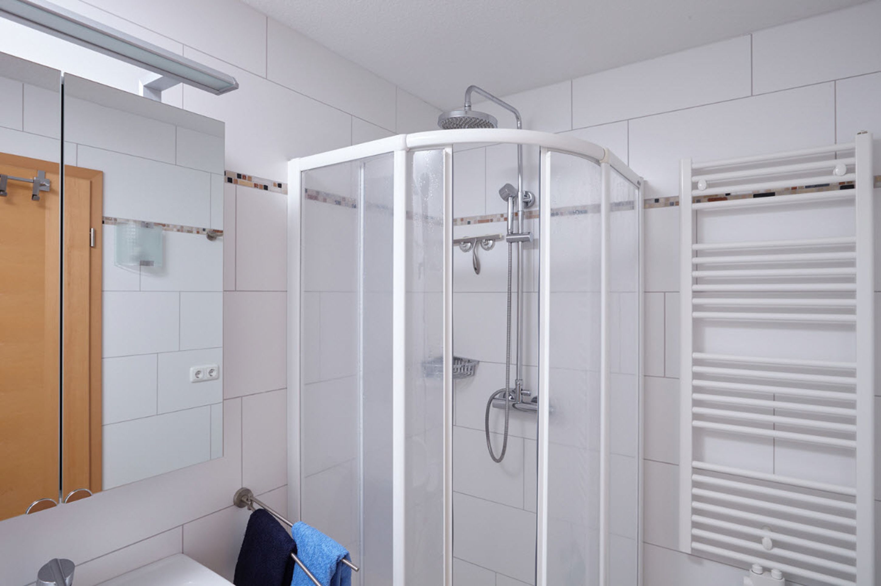 Shower, rainfall showerhead, hair dryer, towels