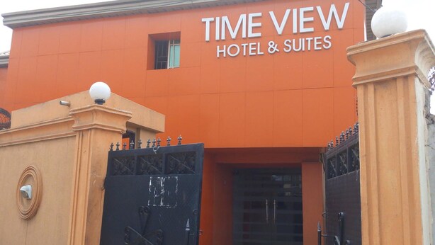A building with a sign that reads "TIME VIEW HOTEL & SUITES". - Time View Hotel & Suites (Lagos)
