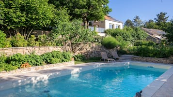 Seasonal outdoor pool, open 8 AM to 7:30 PM, pool umbrellas