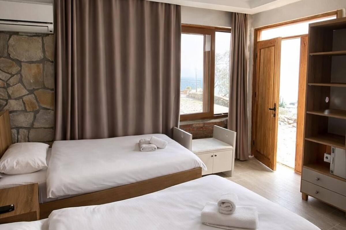 Economy Twin Room, 1 Bedroom, Sea View | Desk, blackout drapes, soundproofing, free WiFi