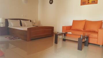 Desk, blackout drapes, iron/ironing board, bed sheets