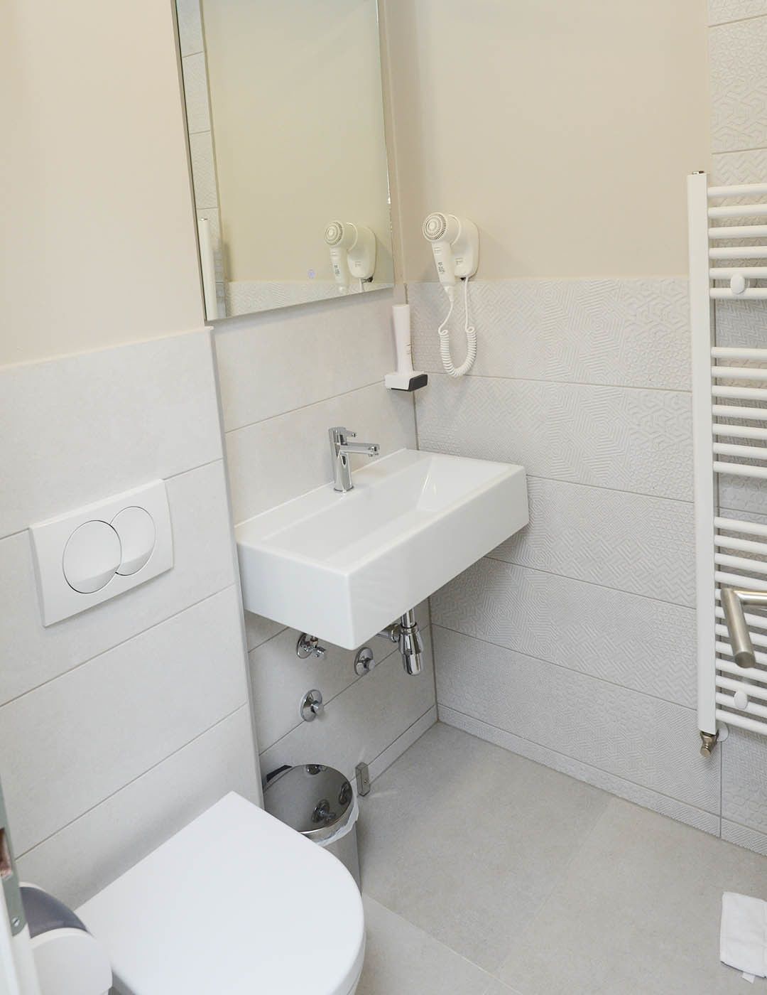 deluxe single room | bathroom | shower, rainfall showerhead, free toiletries, hair dryer