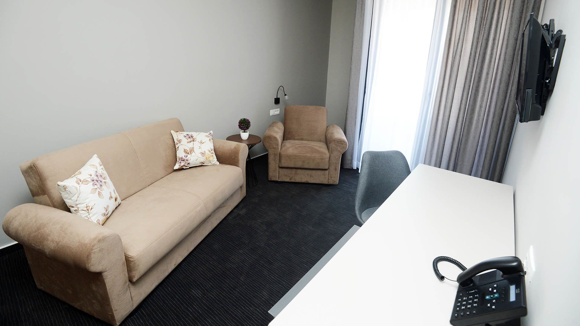 deluxe apartment | living area | 32-inch flat-screen tv with cable channels, tv