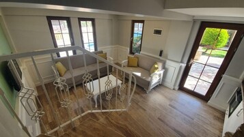 Family Duplex, 1 Bedroom | Living area | 32-inch LED TV with satellite channels