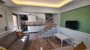 Family Duplex, 1 Bedroom | Living area | 32-inch LED TV with satellite channels