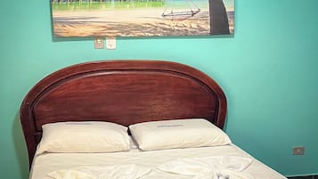 Economy Room, Multiple Beds, Non Smoking | Minibar, WiFi (free), bed sheets