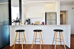Enjoy a casual meal at the kitchen counter with seating for three.