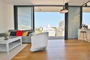Enjoy the city view from the balcony through the large sliding glass door.