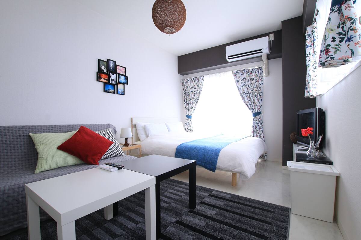 Desk, laptop workspace, blackout curtains, free WiFi