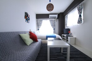 Desk, laptop workspace, blackout curtains, free WiFi