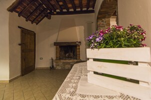 Apartment, 1 Bedroom, Hill View (Piazza della Chiesa, 19) | Living area | 24-inch flat-screen TV with digital channels, TV