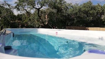 Outdoor pool, open 9:00 AM to 7:00 PM, pool loungers