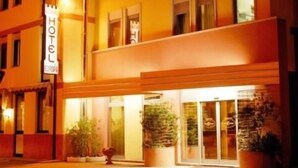 A hotel with a two-story facade, large windows, and a sign indicating it is a hotel. - Hotel Europa (Marostica)