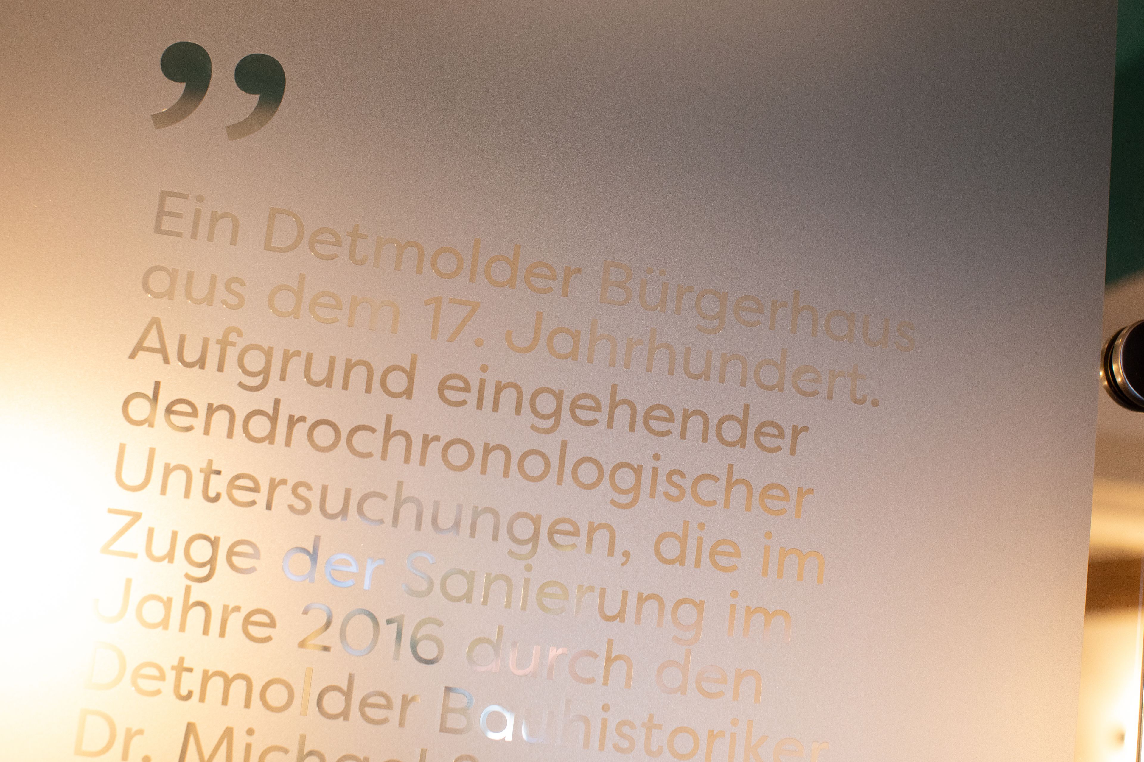 A close-up of a text document with German text, likely a quote or excerpt.