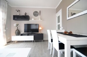 Apartment, 2 Bedrooms | Living area | Flat-screen TV - HomeHolidaysRentals  Maritim V (Pineda de Mar)