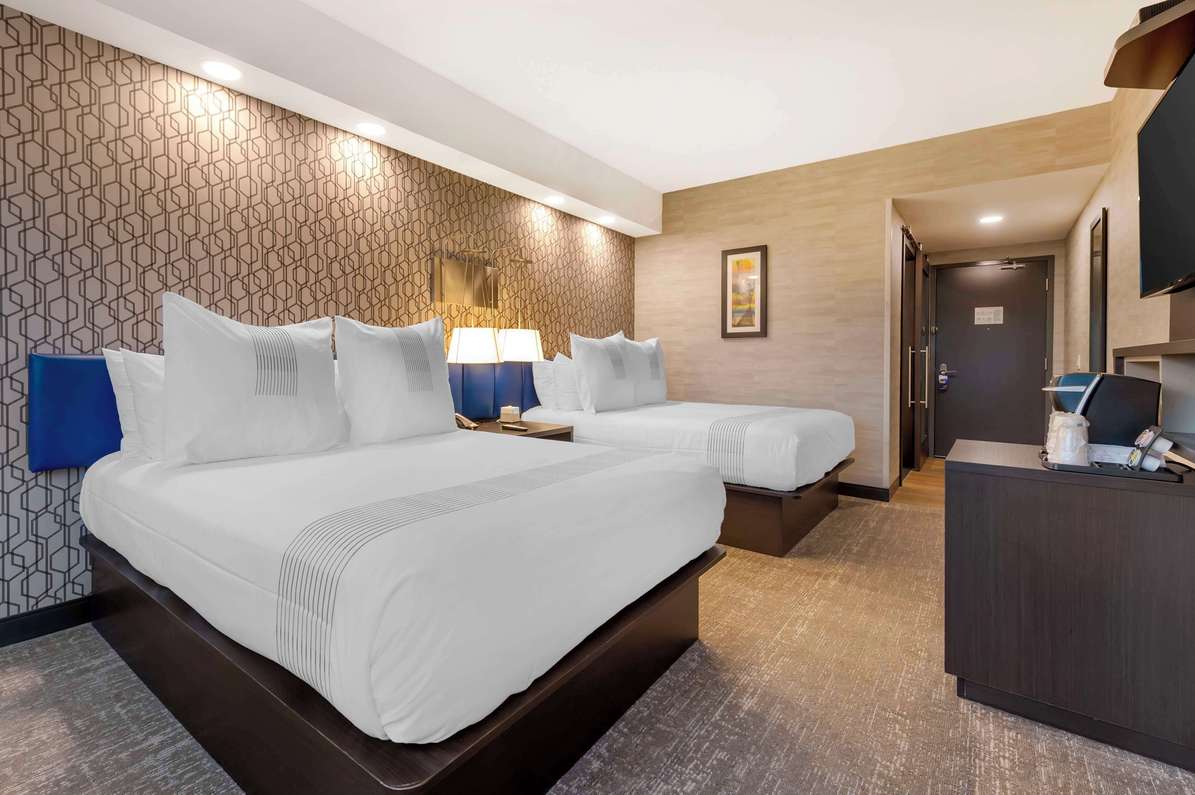 standard room, 2 queen beds, non smoking, refrigerator | pillow-top beds, in-room safe, blackout curtains, iron/ironing board