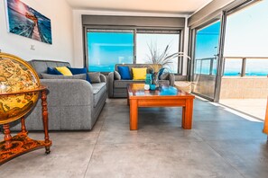 Panoramic Apartment, 2 Bedrooms, Balcony, Sea View | Living room | Flat-screen TV