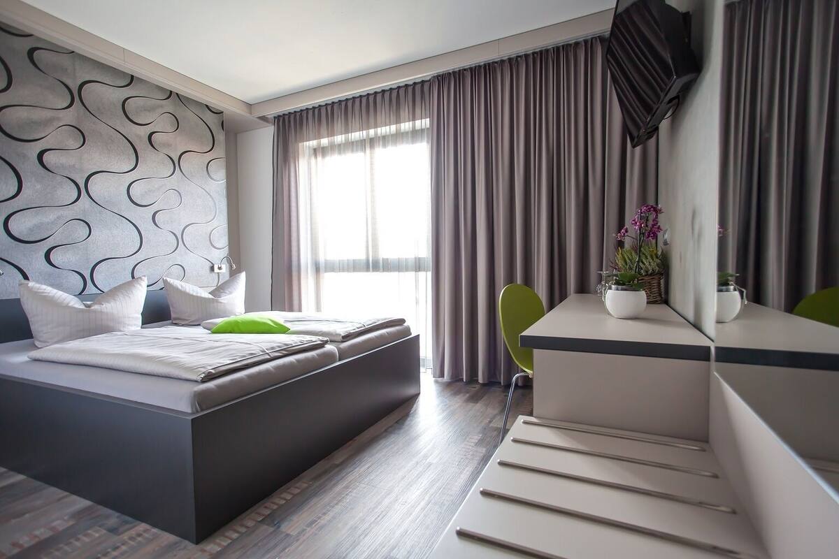 Double Room, City View | Hypo-allergenic bedding available, desk, blackout drapes, soundproofing