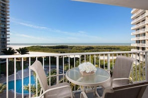Outdoor dining - Beachfront 2BR/2BA Marco Island condo with pool, WiFi, and beach access. (Marco Island)