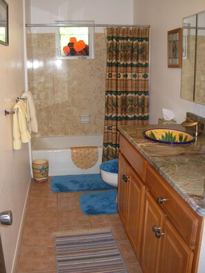 Combined shower/tub, hair dryer, towels, soap