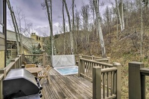 This beautiful home features a deck with a private hot tub.