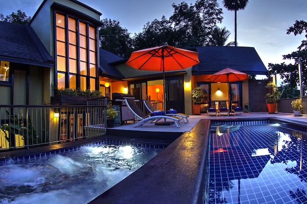 Salt water swimming pool and separate jetted plunge pool
