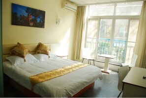 Business Condo, 2 Double Beds, Accessible, Smoking | Premium bedding, down comforters, memory foam beds - Qingdao HoMu Hotel Management Co.Ltd (Qingdao)