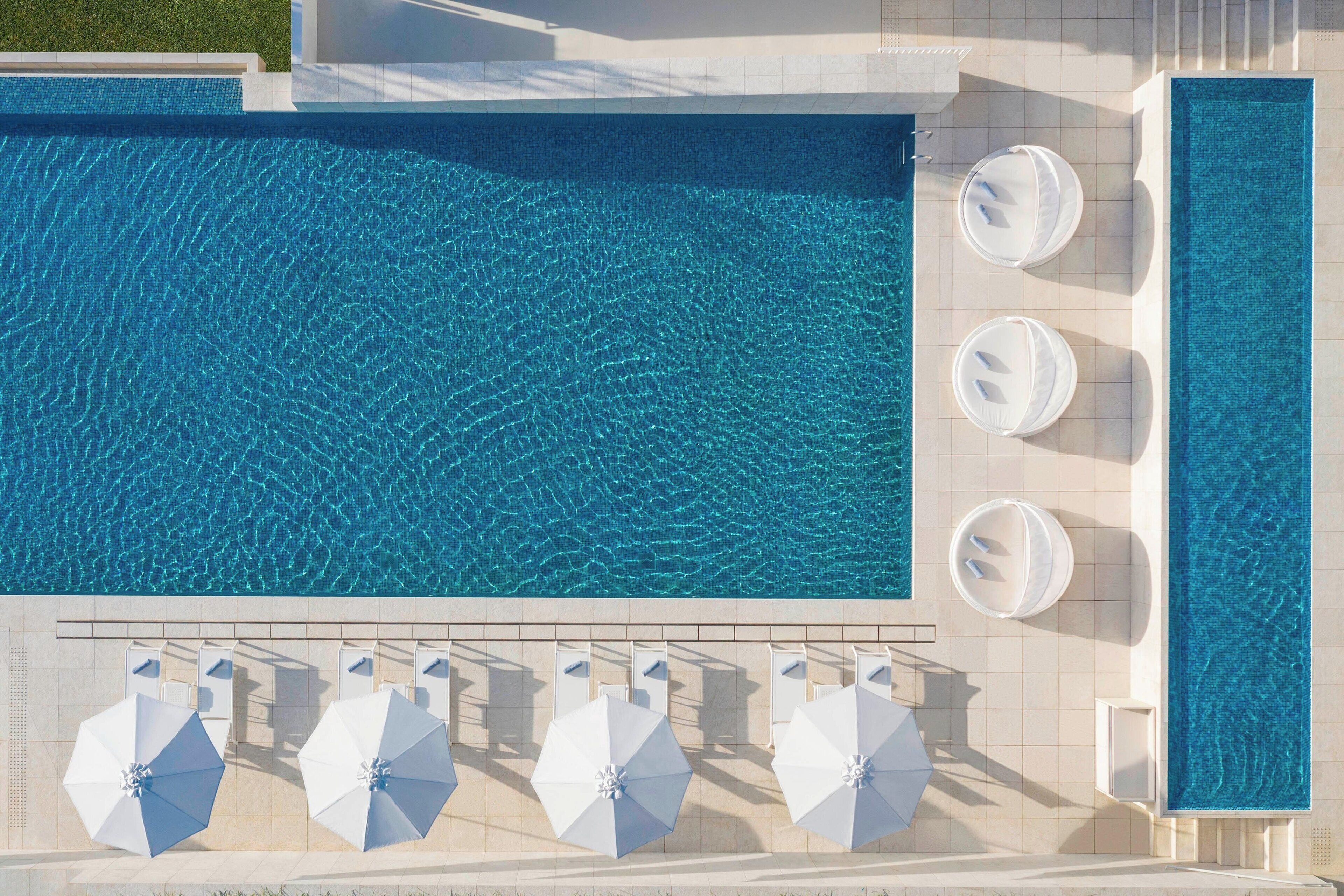 seasonal outdoor pool, open 9:00 am to 9:00 pm, pool umbrellas