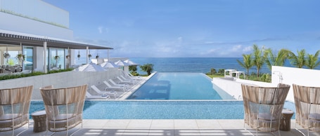 Seasonal outdoor pool, open 9:00 AM to 9:00 PM, pool umbrellas