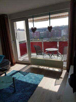 Enjoy the view from your balcony with a round table and two chairs.