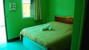 A room with a bed, a window with curtains, and a wall-mounted light switch. - All Day Hotel (Nong Khai)