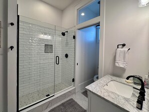 Combined shower/tub, hair dryer, towels, soap