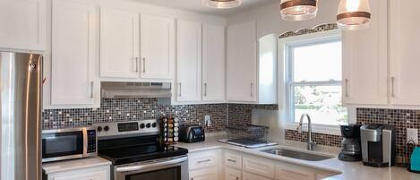 Dishwasher, coffee/tea maker, cookware/dishes/utensils