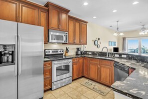 Dishwasher, coffee/tea maker, cookware/dishes/utensils, ice maker - The Dunes: Ocean View Condo with Community Pool, Hot Tub, Beach Access (Oak Island)