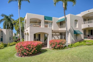 Experience the sleek, contemporary design of this hotel, featuring large windows, balconies, and outdoor seating areas amidst well-manicured gardens.