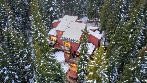A large, multi-story lodge surrounded by snow-covered trees. - Blue Bend Beauty | Comfort & Privacy with Postcard Views & Private Hot Tub (Breckenridge)