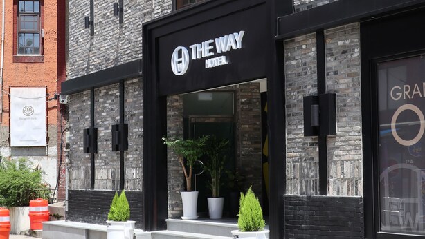 A hotel with a modern brick facade, large windows, and a sign reading "The Way Hotel". - The Way Hotel (Busan)