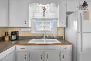 Dishwasher, coffee/tea maker, highchair, cookware/dishes/utensils
